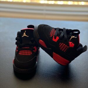 Size 4C 
Worn in good condition 
Red & Black THUNDER 4 Jordans